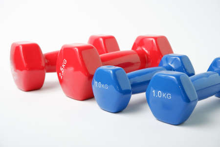Simple Dumbbell. Blue and red dumbbells for fitness on a white background.