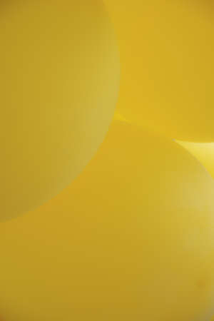 Background from yellow balloons. Blurred Photo of balloons for backgroundの写真素材