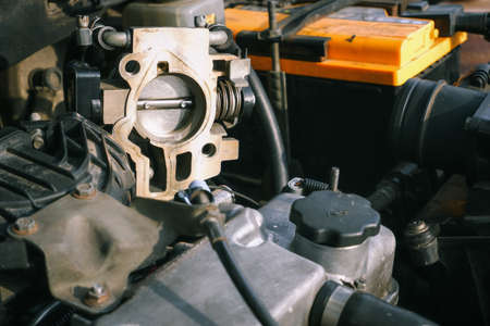 car repair. Cleaning the throttle valve of the injection engine.