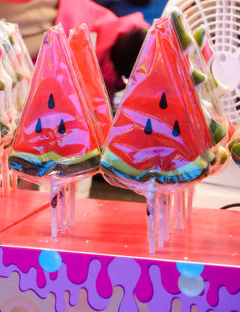 Watermelon-shaped lollipops on display. Sweetsの写真素材