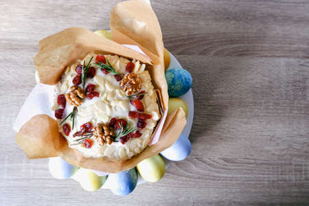 Easter composition. Decorated Easter sweet cake painted eggs on a plate. Place for text. Easter cake...