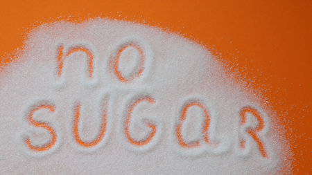Word no sugar hand lettering on a placer of refined white sugar. healthy dietの写真素材
