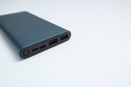 Power bank mockup isolated on white background. Gray metallic USB power bank for smartphones and tablet computers charging isolated on white backgroundの写真素材