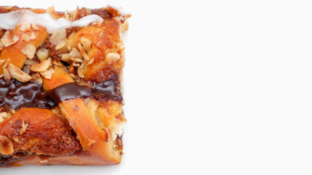 Delicious cake with peanut butter cream layer and chocolate topping. Bakery white background.の写真素材