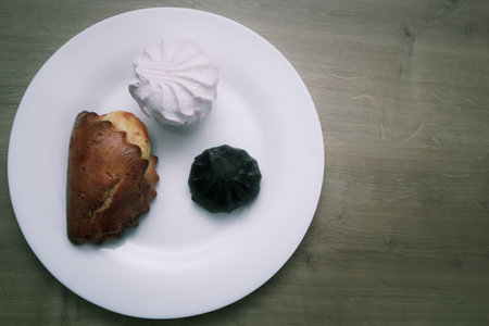 The concept of nutrition and unhealthy eating. Marshmallow, zephyr. pastry. sweetness, sweet cake,...