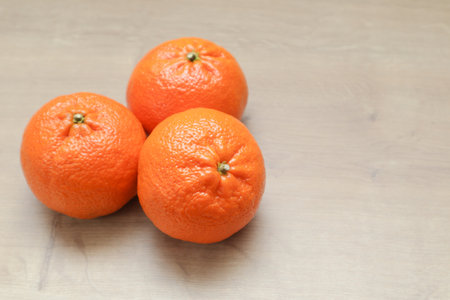 Mandarin on wooden table. Ripe citrus fruit on the wooden table. Tangerines on wooden tableの写真素材