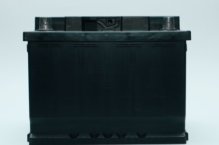 Black lead acid battery for car. Auto concept isolated on white. Concept of service, maintenance,...