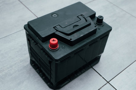 Plus and minus of the old battery. Charging car battery with electric current.
