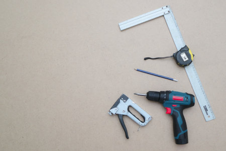 construction tools. Set of tools over wooden background, top view with space for textの写真素材