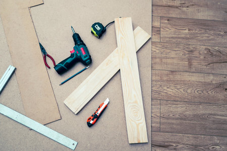 construction tools. Set of tools over wooden background, top view with space for textの写真素材