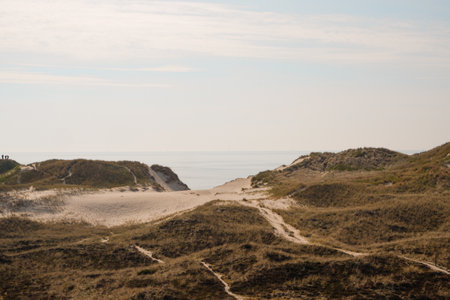 Sand dune on north sea coast. Aerial view of Lyngvig lighthouse on wide dune of Holmsland Klit with beach view on the west coast of Jutland, by Hvide Sande, Denmark.の写真素材