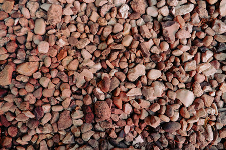 Rounded sea stones as a blind area around the cottage. Small sea stones, gravel. background....