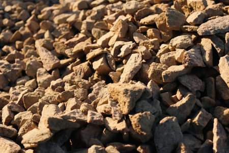 Granite gravel chips materials for the construction. Natural crushed granite gravel as a background. Industrial design. Granite gravel textureの写真素材