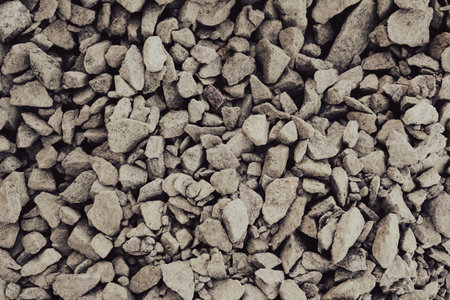 Granite gravel chips materials for the construction. Natural crushed granite gravel as a background....