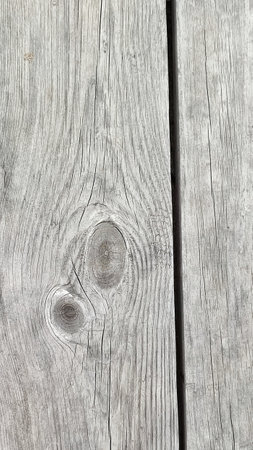 Wood texture background. Rough surface of old knotted table with nature pattern. Top view. Weathered gray wood planks. Old gray rustic wood background, wooden surface.の写真素材