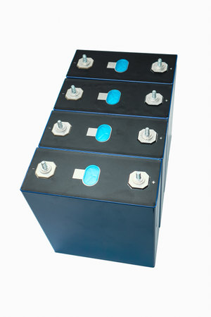 Row of LiFePo4 cells on white background. Lithium Iron Phosphate LiFePO4 blue prismatic cell isolated on white. Prismatic modules for lithium iron phosphate battery.の写真素材