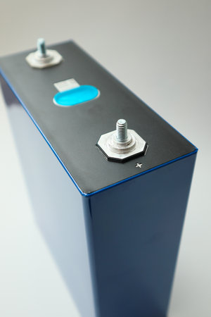 Lithium Iron Phosphate LiFePO4 blue prismatic cell for an electric vehicle battery isolated on white. Prismatic battery, LFP cell. Sustainable Energy Solutionsの写真素材