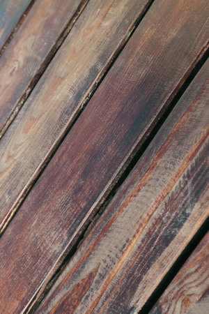 Weathered brown wood board textured background. Vintage wooden backdrop. The surface of weathered brown wood texture.の写真素材