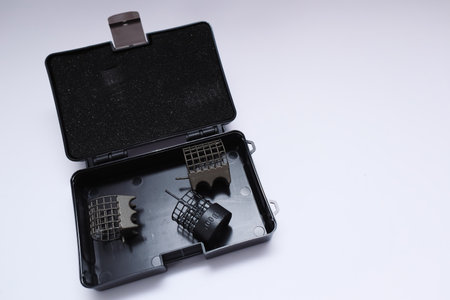 Open box with fishing accessories. Organized fishing tackle box displaying various toolsの写真素材