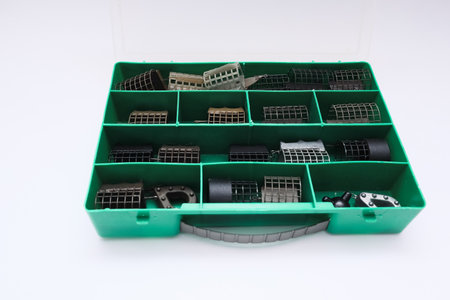 Open box with fishing accessories. Organized fishing tackle box displaying various toolsの写真素材