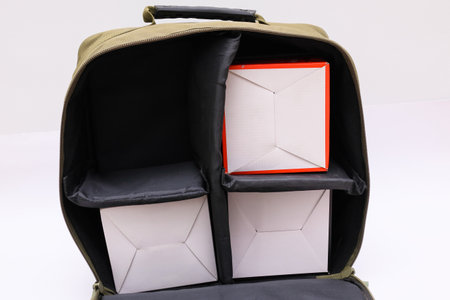 Tackle Storage Bag on White Background. Fishing bag with equipment on a white.の写真素材
