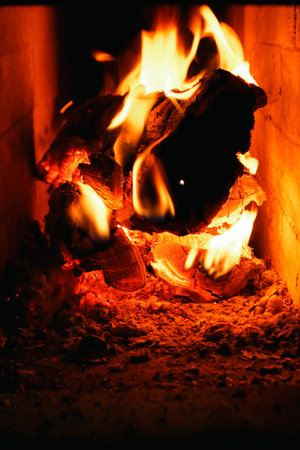Firewood and fire in the stove.. Burning Fire. Flames and fire from burning wood.の写真素材