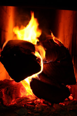 Firewood and fire in the stove.. Burning Fire. Flames and fire from burning wood.の写真素材