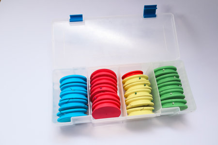 Open box with fishing accessories. Organized fishing tackle box displaying various toolsの写真素材