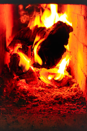 Firewood and fire in the stove.. Burning Fire. Flames and fire from burning wood.の写真素材