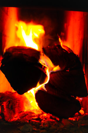 Firewood and fire in the stove.. Burning Fire. Flames and fire from burning wood.の写真素材