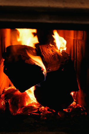 Firewood and fire in the stove.. Burning Fire. Flames and fire from burning wood.の写真素材