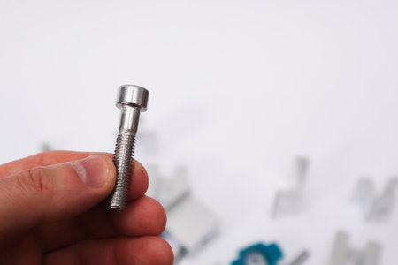 Cropped Hand Of Person Showing Screws. Alternative and renewable energy concept.の写真素材