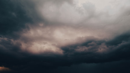 Dramatic thunderstorm with dark clouds in the evening. Dramatic sky of clouds reflecting strong hues...