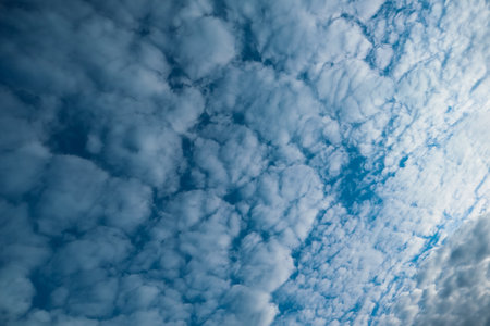 Nature background of sky with blue clouds on sunset. Beautiful cloud above dramatic blue sunset sky. Cloudy backgroundの写真素材