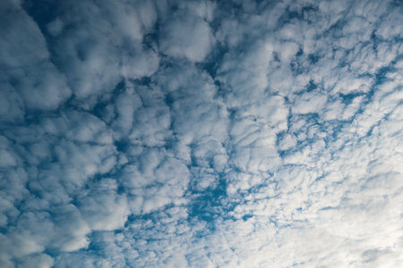 Nature background of sky with blue clouds on sunset. Beautiful cloud above dramatic blue sunset sky....