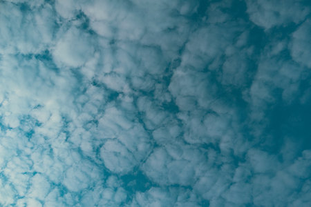 Nature background of sky with blue clouds on sunset. Beautiful cloud above dramatic blue sunset sky....