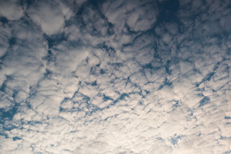 Nature background of sky with blue clouds on sunset. Beautiful cloud above dramatic blue sunset sky....