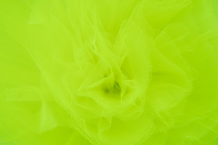 Teal silk fabric drapes, elegant waves, background, textile design. A close-up shot of a teal satin fabric, showing its smooth, glossy textureの写真素材