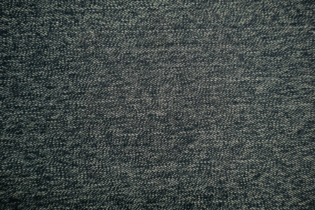 Detailed close-up of gray woven textile fabric with fine texture. Ideal for use as a background,...