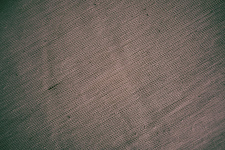 Detailed macro shot of brown fabric showing fine textile weave and smooth texture. Ideal background for design, fashion, upholstery, or material texture concepts.の写真素材