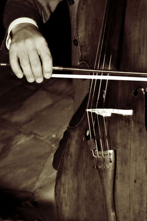 a man playing a cello - sepia finishの写真素材