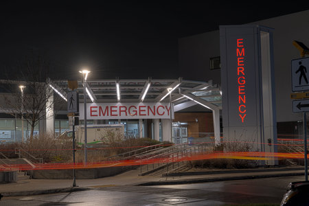 WINNIPEG, MANITOBA, CANADA - May 15, 2026: The emergency department entrance at Grace Hospital is illuminated at night in Winnipeg, Manitoba.