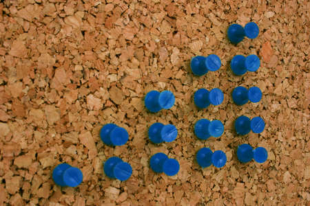 Pushpins illustrate a rise in sales, profits, whatever you have in mind.の写真素材