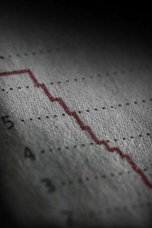 Shallow depth of field on a line graph going way down.の写真素材