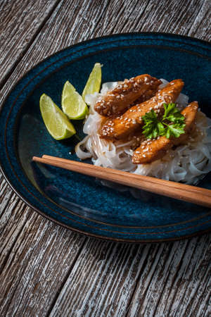 The chicken in teriyaki sauce with sesame and lime.の写真素材