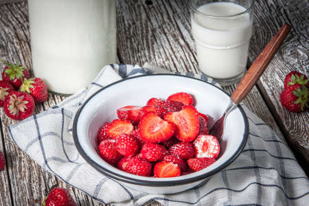 Strawberries with sugar for dessert with fresh milk.の写真素材