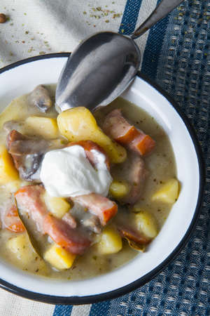 Polish sour soup with sausage and bread.の写真素材