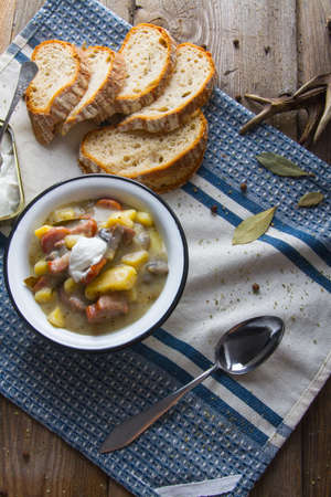 Polish sour soup with sausage and bread.の写真素材