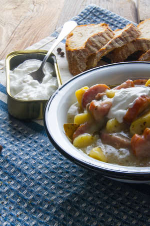 Polish sour soup with sausage and bread.の写真素材