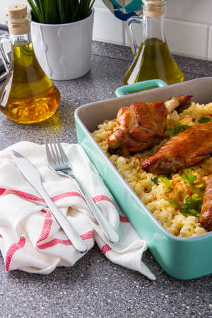 Baked spicy wings of turkey with cheese noodles.の写真素材